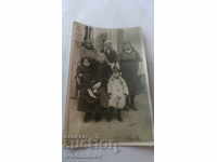 Photo Four women and two children
