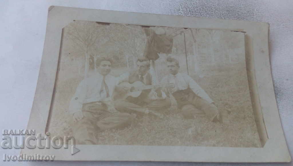 Photo Three young men on the meadow 1925