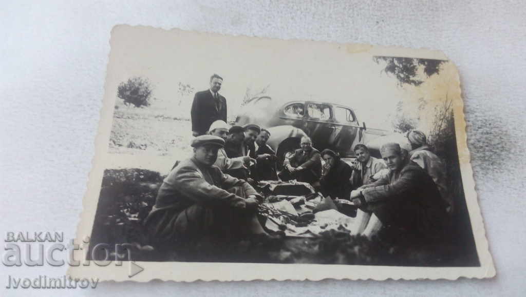 Photo Company with a retro car on a picnic