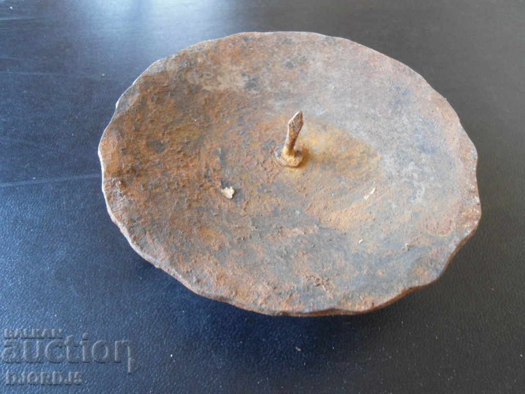 Auction  An old forged candlestick
