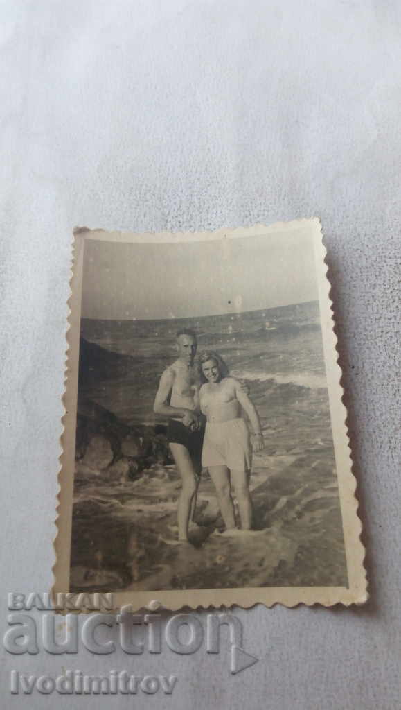 Fotografie Bărbat și femeie pe plajă