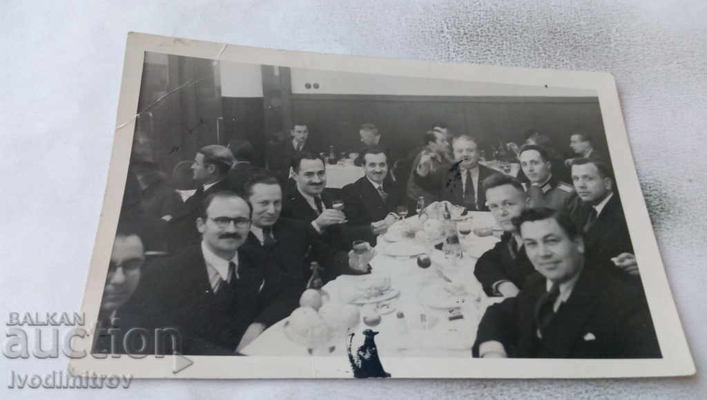 Photo Officer and civilians at dinner 1942