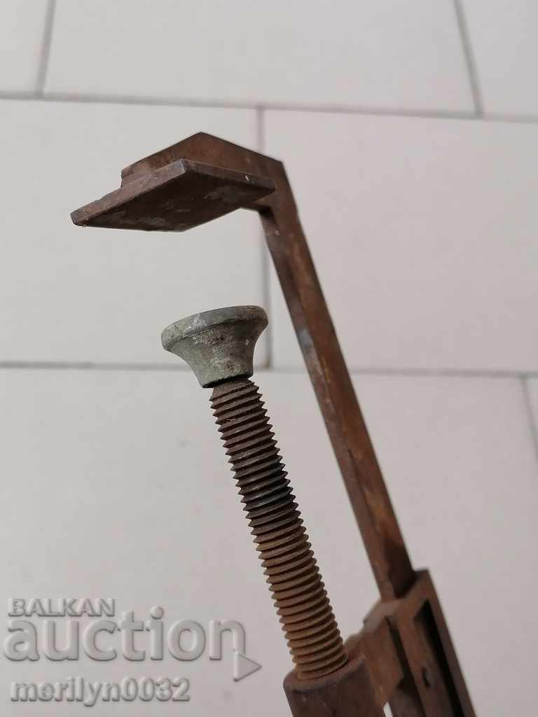 Delivery of An old carpenter's clamp, a socket, a wooden tool Delivery of An old carpenter's clamp, a socket, a wooden tool