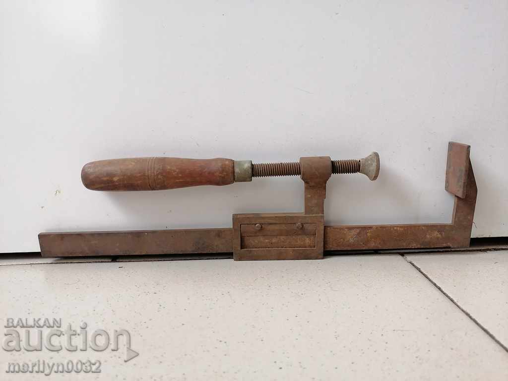 An old carpenter's clamp, a socket, a wooden tool - 5 An old carpenter's clamp, a socket, a wooden tool - 5