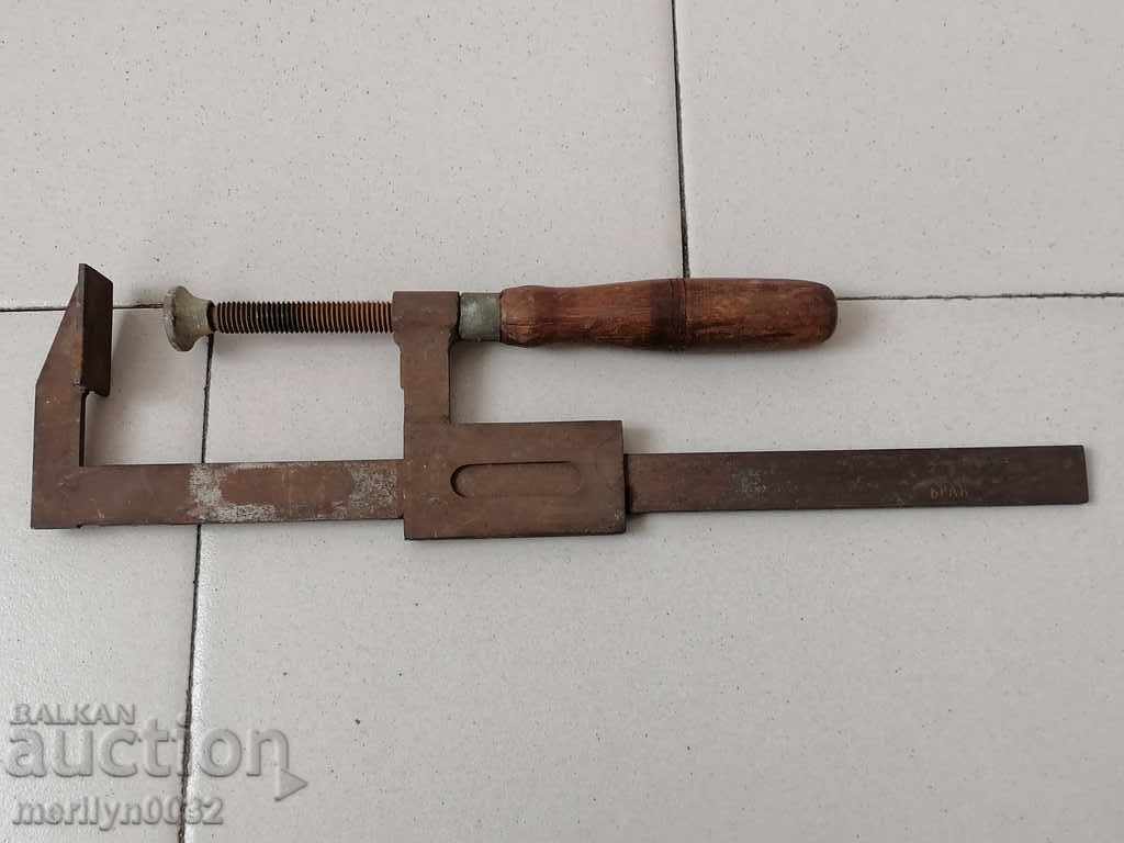 An old carpenter's clamp, a socket, a wooden tool - 7 An old carpenter's clamp, a socket, a wooden tool - 7