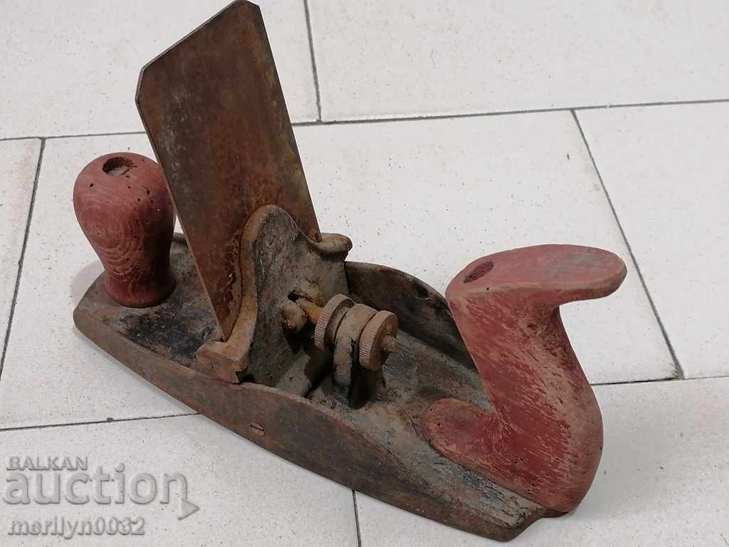 An old woodworking planer with a knife