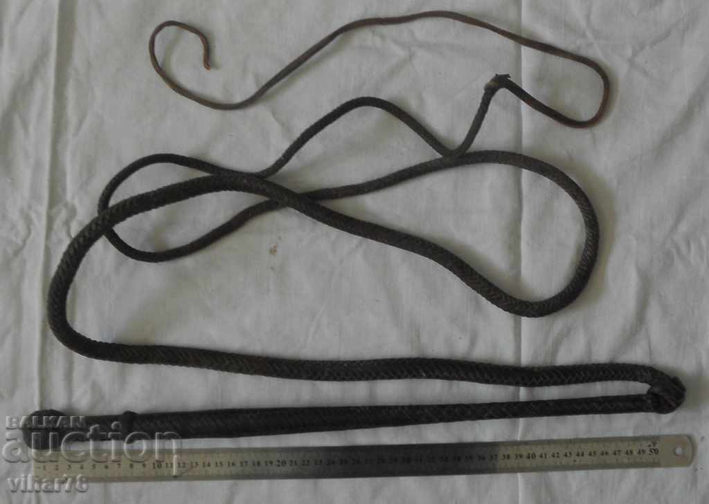 Auction AN OLD LEATHER WHIP Auction AN OLD LEATHER WHIP