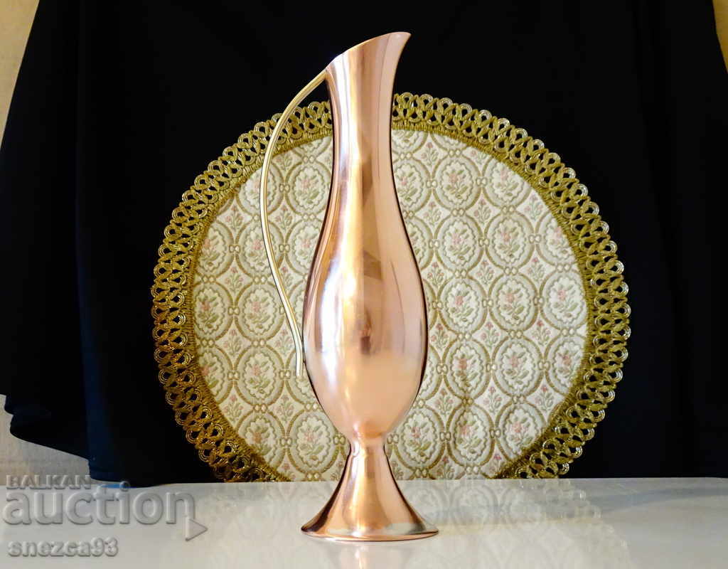 Elegant copper jug, vase.
