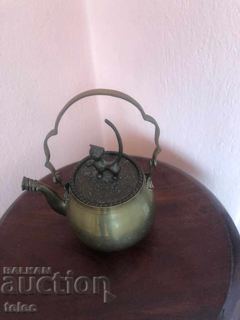 Beautiful teapot with a lid with a cat