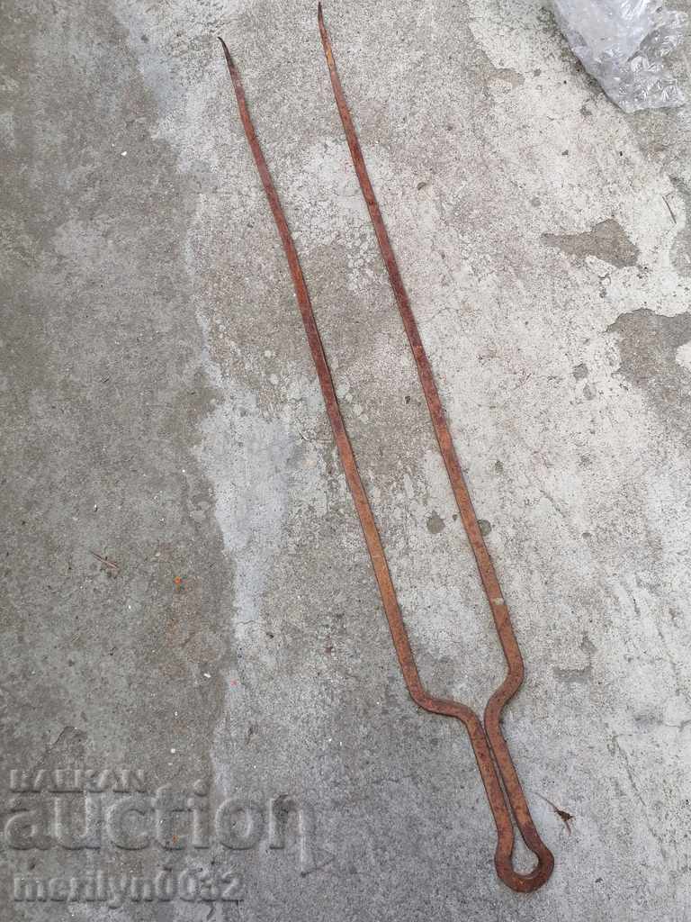 Old wrought iron double skewer for roasting wrought iron meat