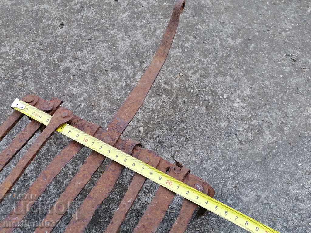 Delivery of An old hand-forged grill, a steak, wrought iron Delivery of An old hand-forged grill, a steak, wrought iron