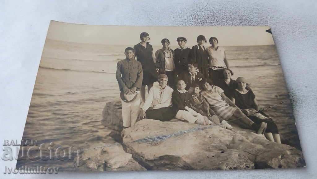 Photo Mesemvria Girls and boys on a rock on the shore