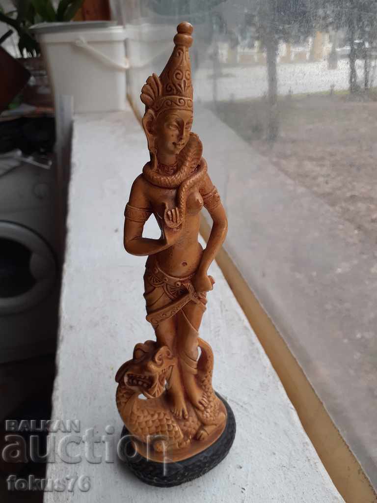 An old statuette of a Chinese figure paste resin