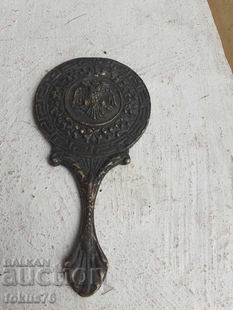 Old bronze little mirror with a double-headed eagle