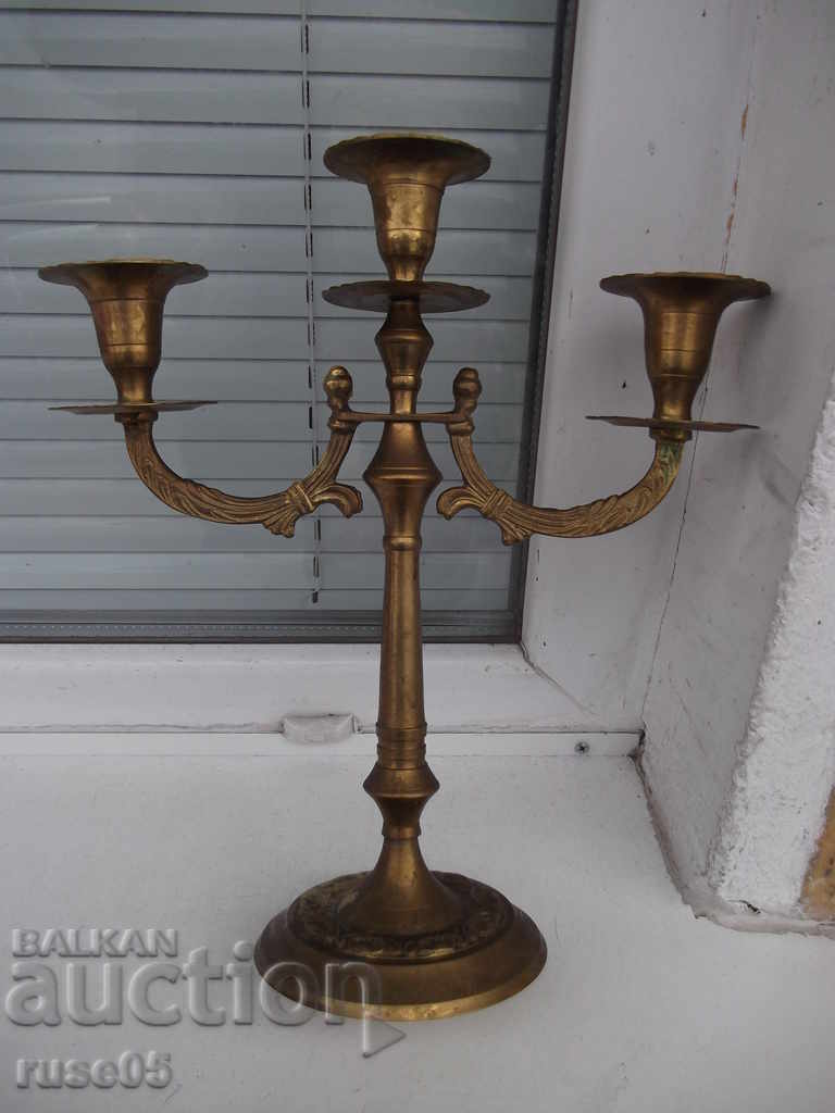 Bronze candlestick for three candles