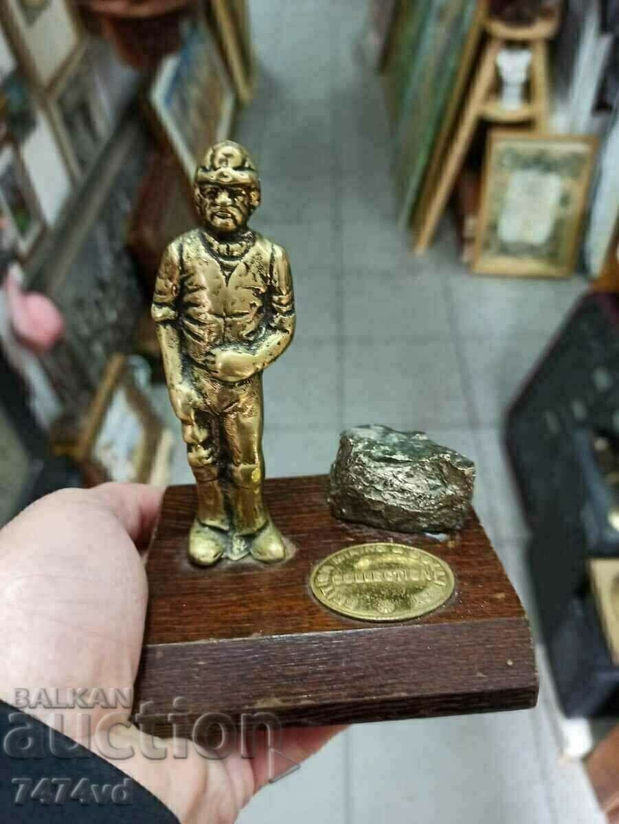 Delivery of Bronze sculpture Miner with pyrite I think is the stone. Delivery of Bronze sculpture Miner with pyrite I think is the stone.