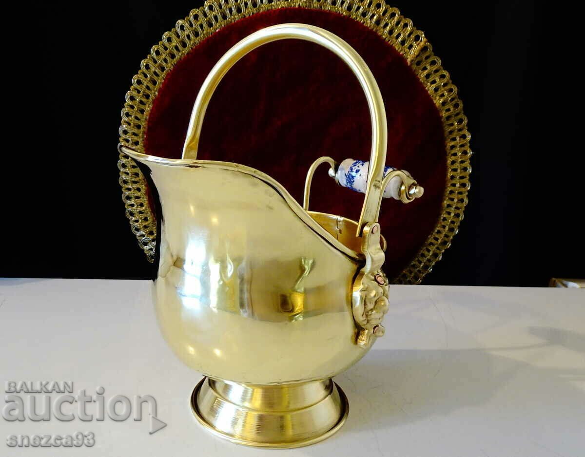 Antique brass vessel, lion heads, porcelain.
