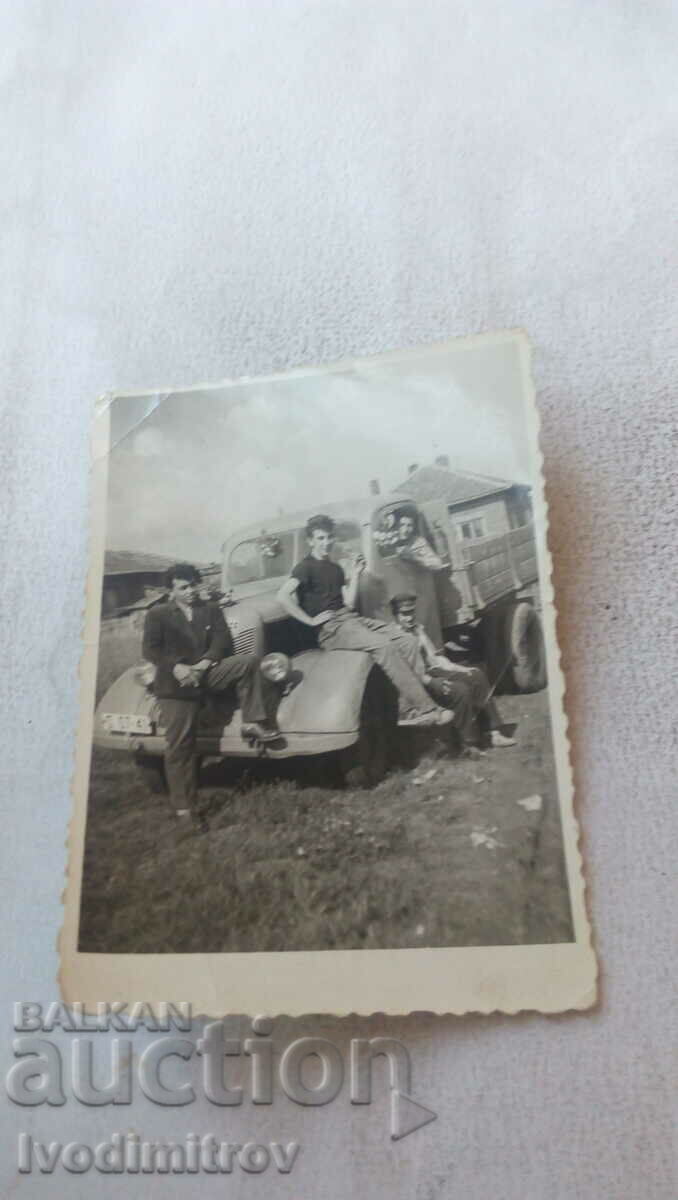 Photo Young people with a retro truck with registration ф Sf 07 - 41