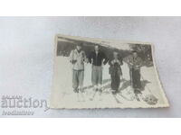 Photo Four skiers