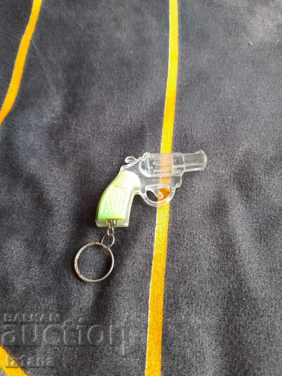 Old keychain, cap pistol, pistol