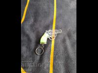 Old keychain, cap pistol, pistol