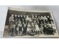 Снимка Ученици от I в отделение със своята учителка 1934