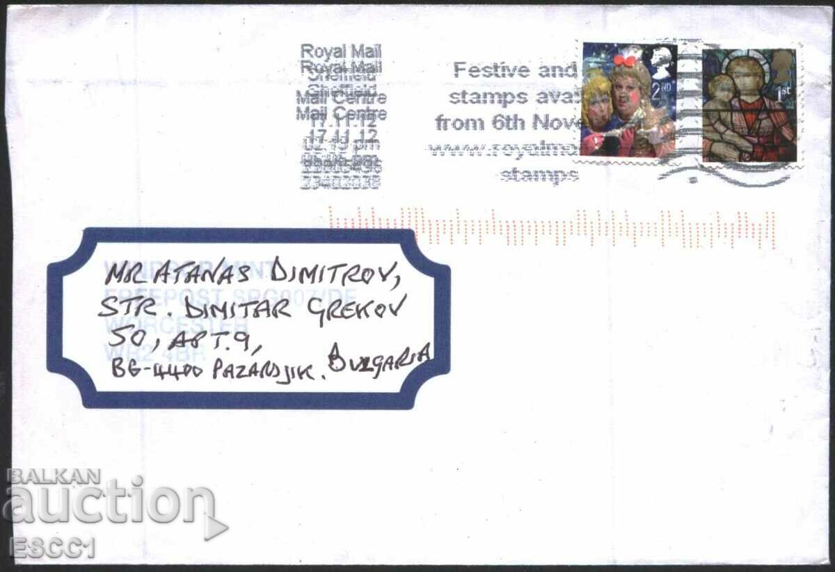 A călătorit într-un plic cu timbre de Crăciun 2011 din Marea Britanie