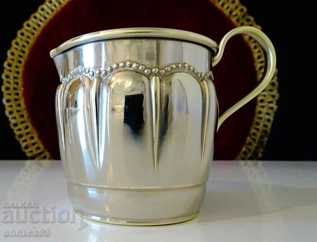 Silver-plated jug, lattice, relief. Silver-plated jug, lattice, relief.