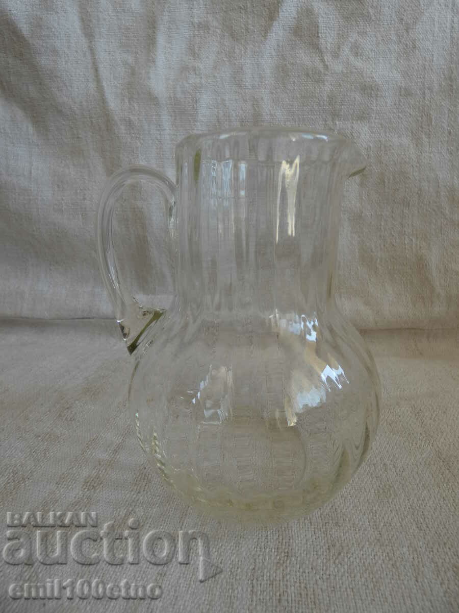 A small glass jug
