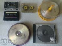 Lot of old audio cassettes and discs.