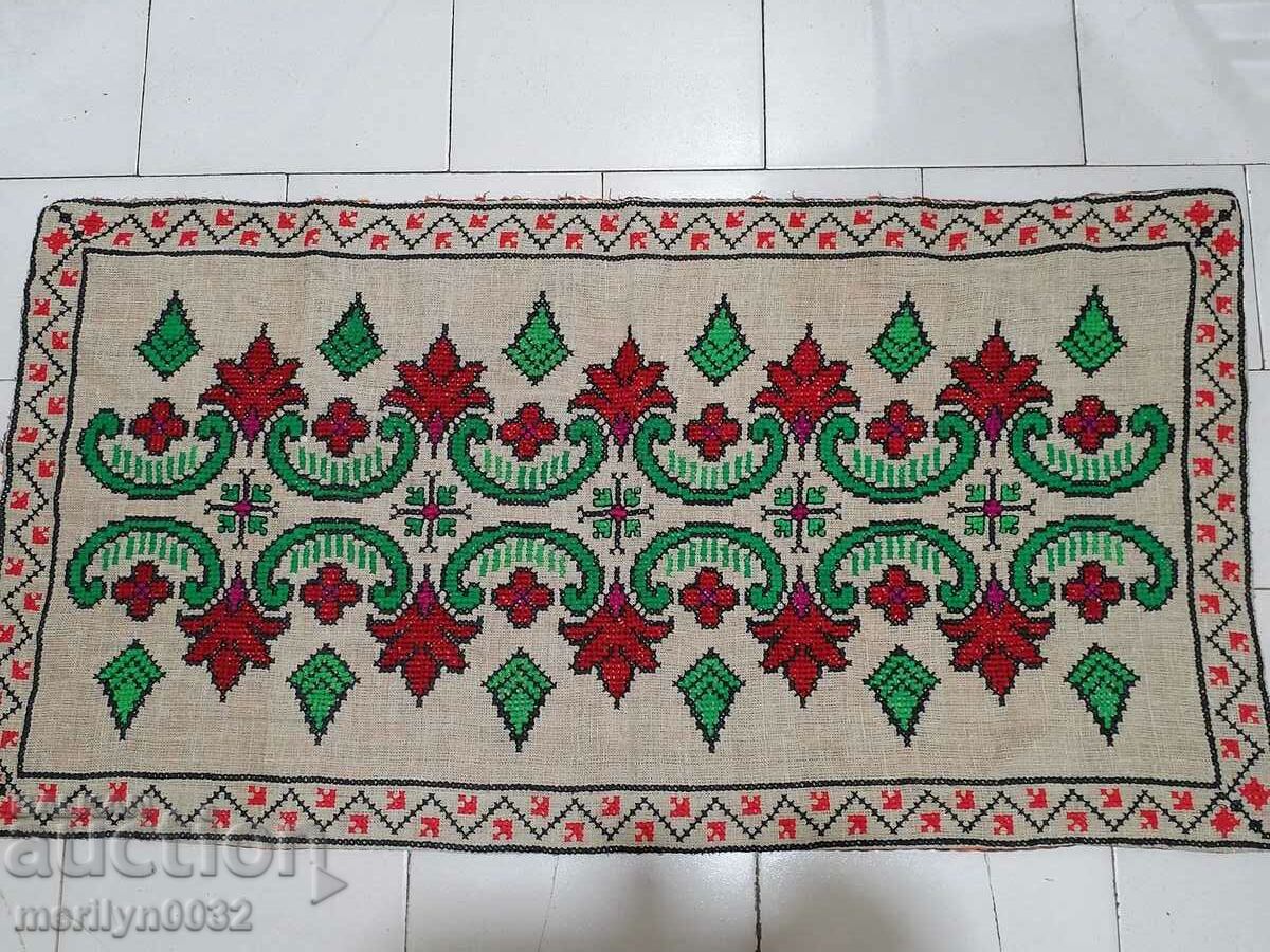 Hand woven rug with embroidery costume