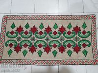 Hand woven rug with embroidery costume