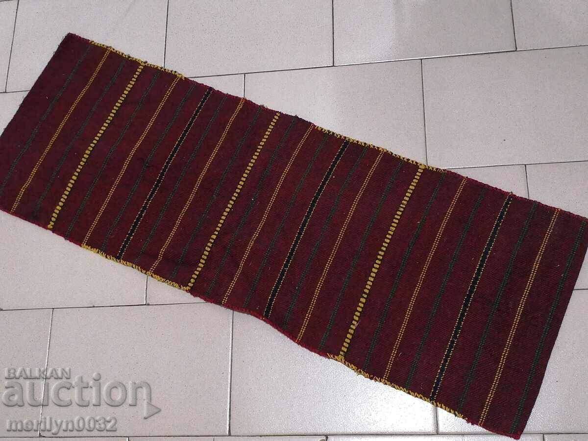 Hand-woven pillow case on a mattress