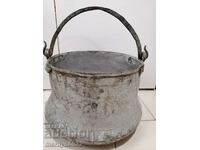 An old copper boiler, a pot, a malt, a baker