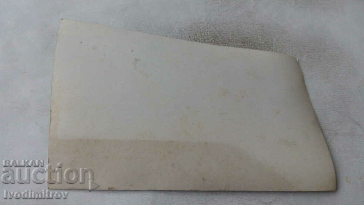 Photo of a man in a swimsuit in front of a bungalow with price 2.65 BGN | € 1.35 Photo of a man in a swimsuit in front of a bungalow with price 2.65 BGN | € 1.35