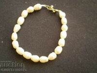 bracelet made of natural white river pearls is made by hand