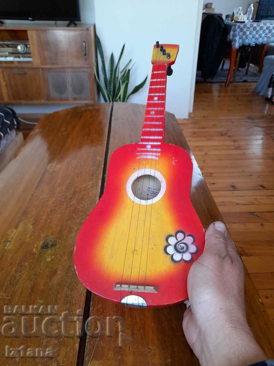 Old children's guitar with price 40.00 BGN | € 20.45 Old children's guitar with price 40.00 BGN | € 20.45