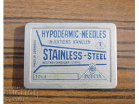 unused German medical needles in a metal box