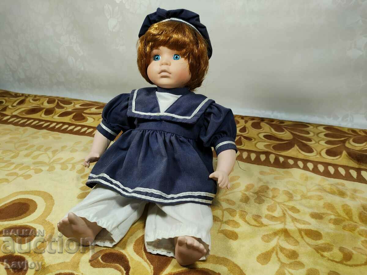 An old porcelain doll with price 30.00 BGN | € 15.34