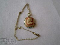 locket cameo on chain brass multicolored glass