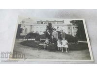 Photo Kyustendil Family on a park bench in front of the bathroom