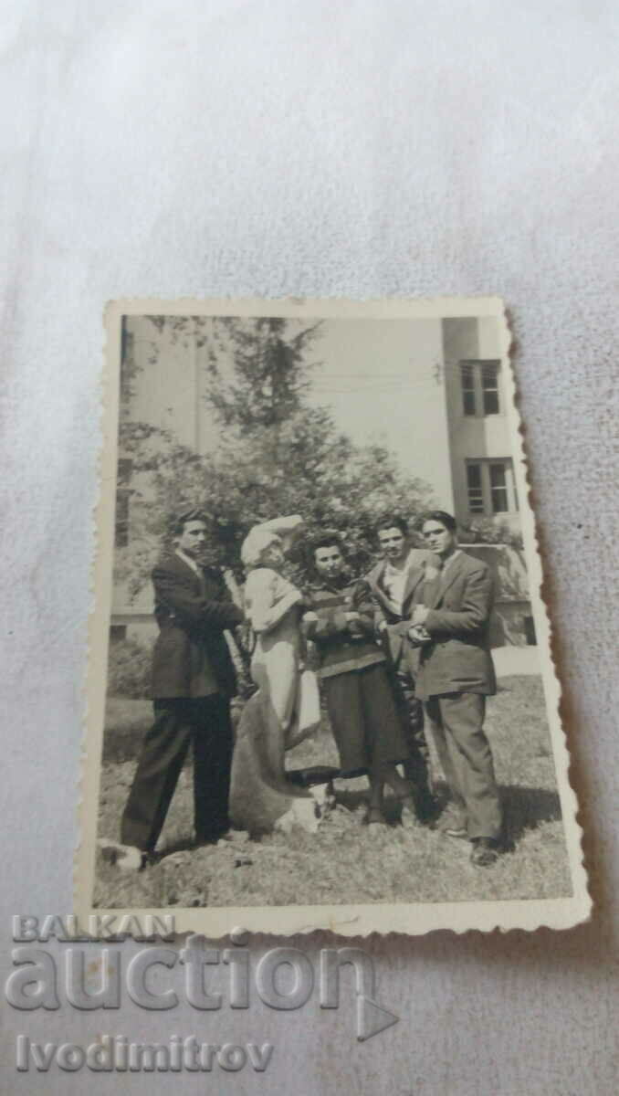 Photo of Sofia Four young men next to a statue