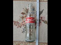 A BOTTLE OF CocaCola