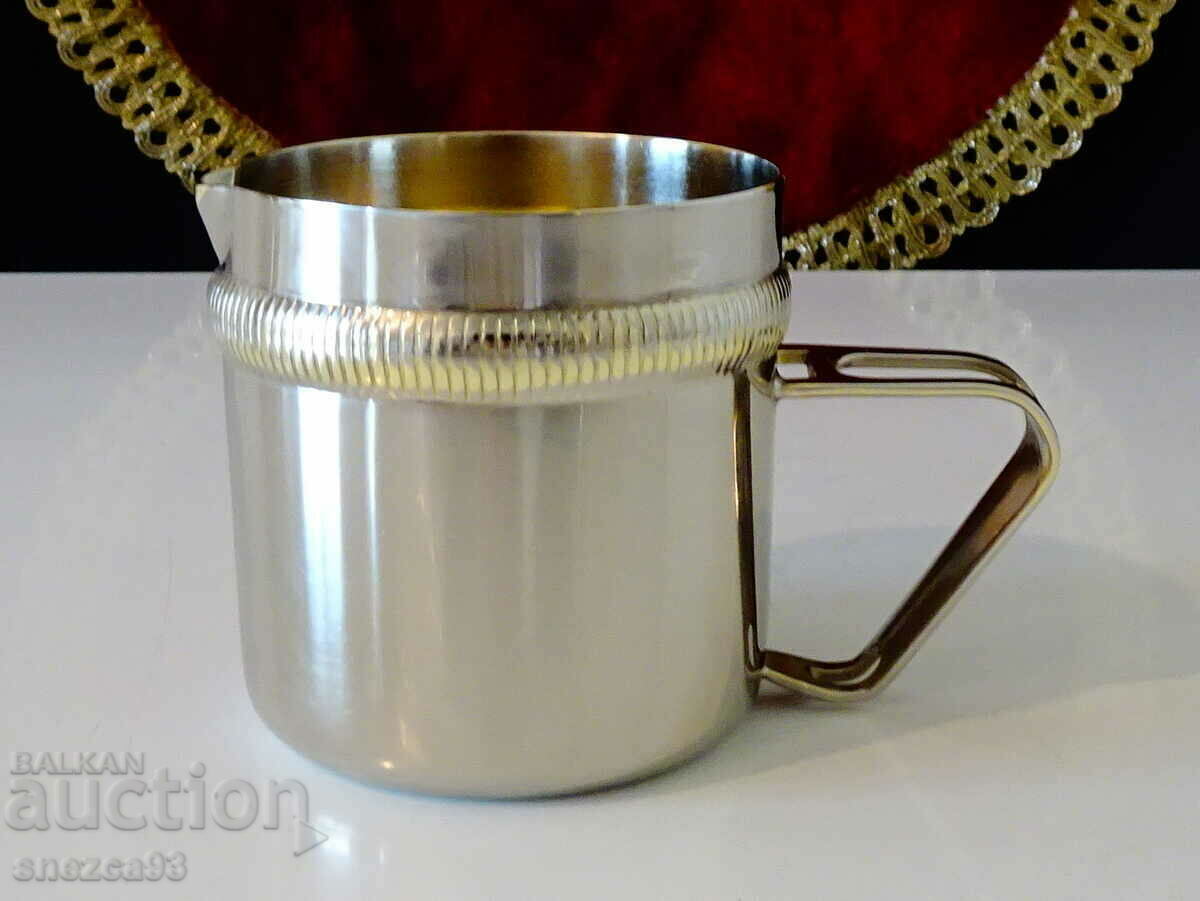 Silver-plated jug, brass liner. Silver-plated jug, brass liner.