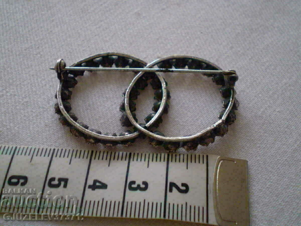 Auction Women's brooch with crystals and silver plating Auction Women's brooch with crystals and silver plating