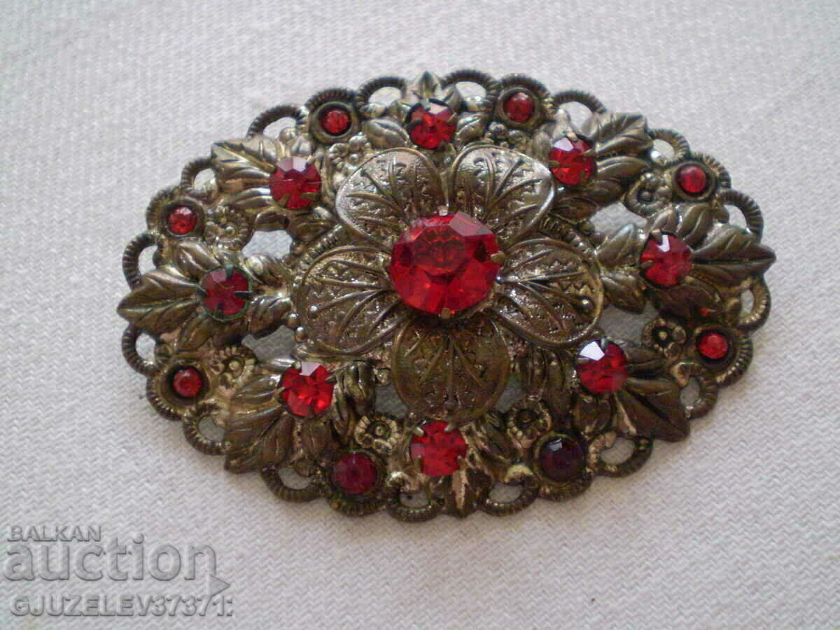 Auction Old Women's Brooch with red zircons Auction Old Women's Brooch with red zircons