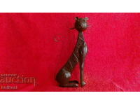 O veche figură de metal a lui Kote