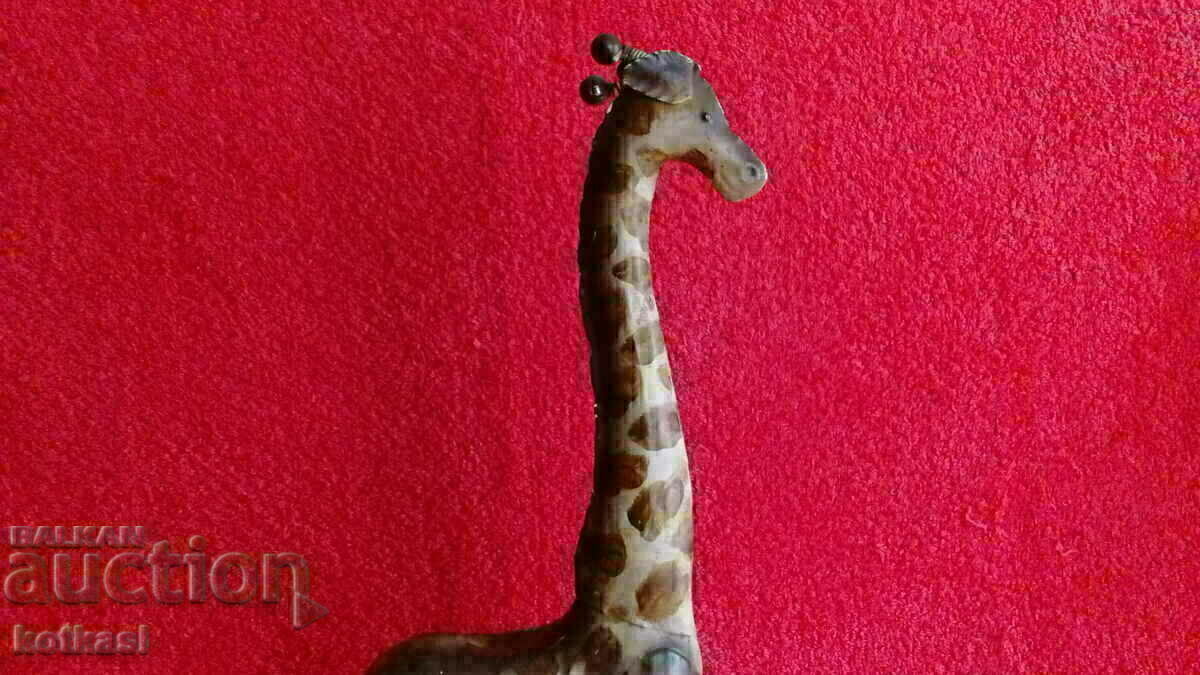 Auction An old metal figure of a Giraffe Auction An old metal figure of a Giraffe