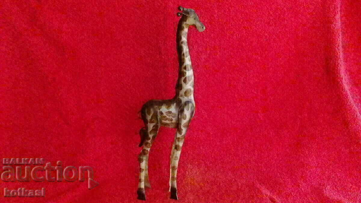 An old metal figure of a Giraffe An old metal figure of a Giraffe