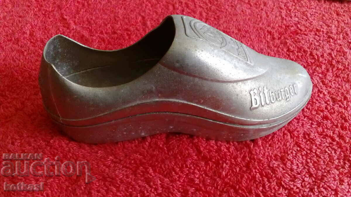 Old metal bottle opener Bitburger football sports shoe
